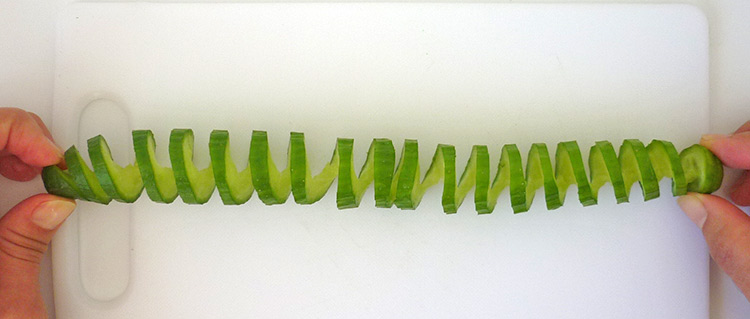 Quick food art with cucumber spiral, bend the spiral into a circle step 3