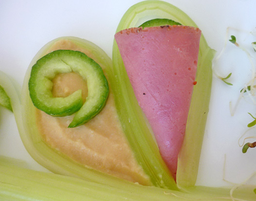 Food art with starry celery tree, garnishing with pastrami and dipping sauce step 4